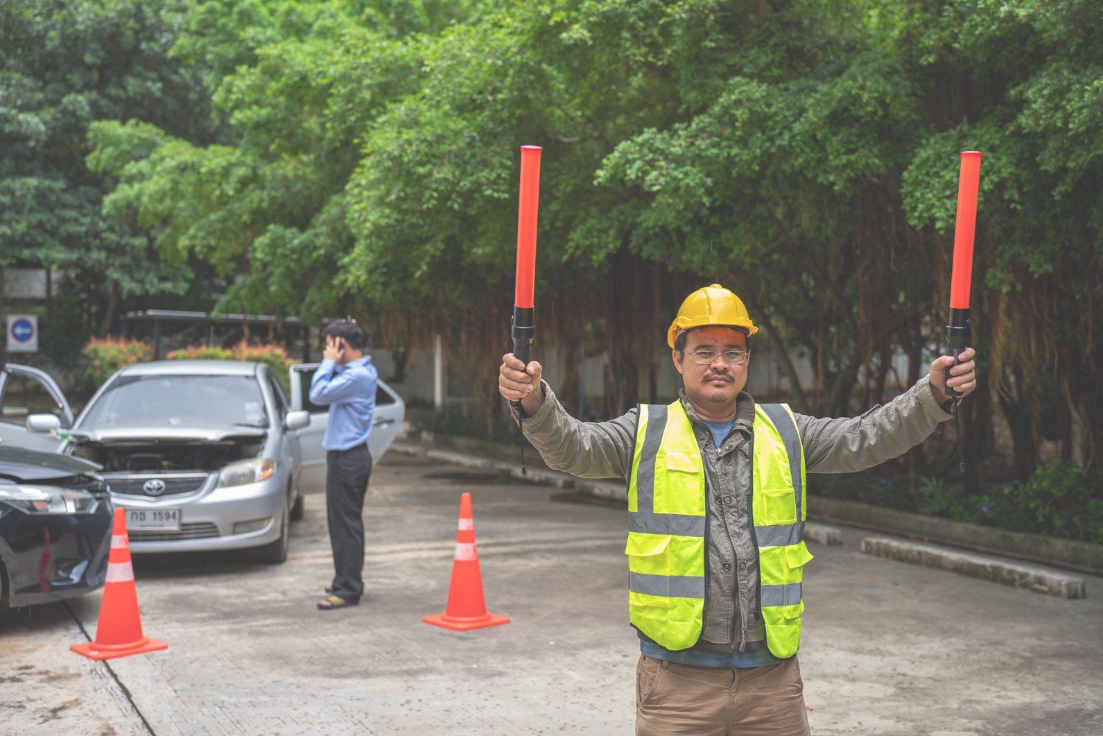 Traffic Man directing traffic after Crash Accident on the Road.